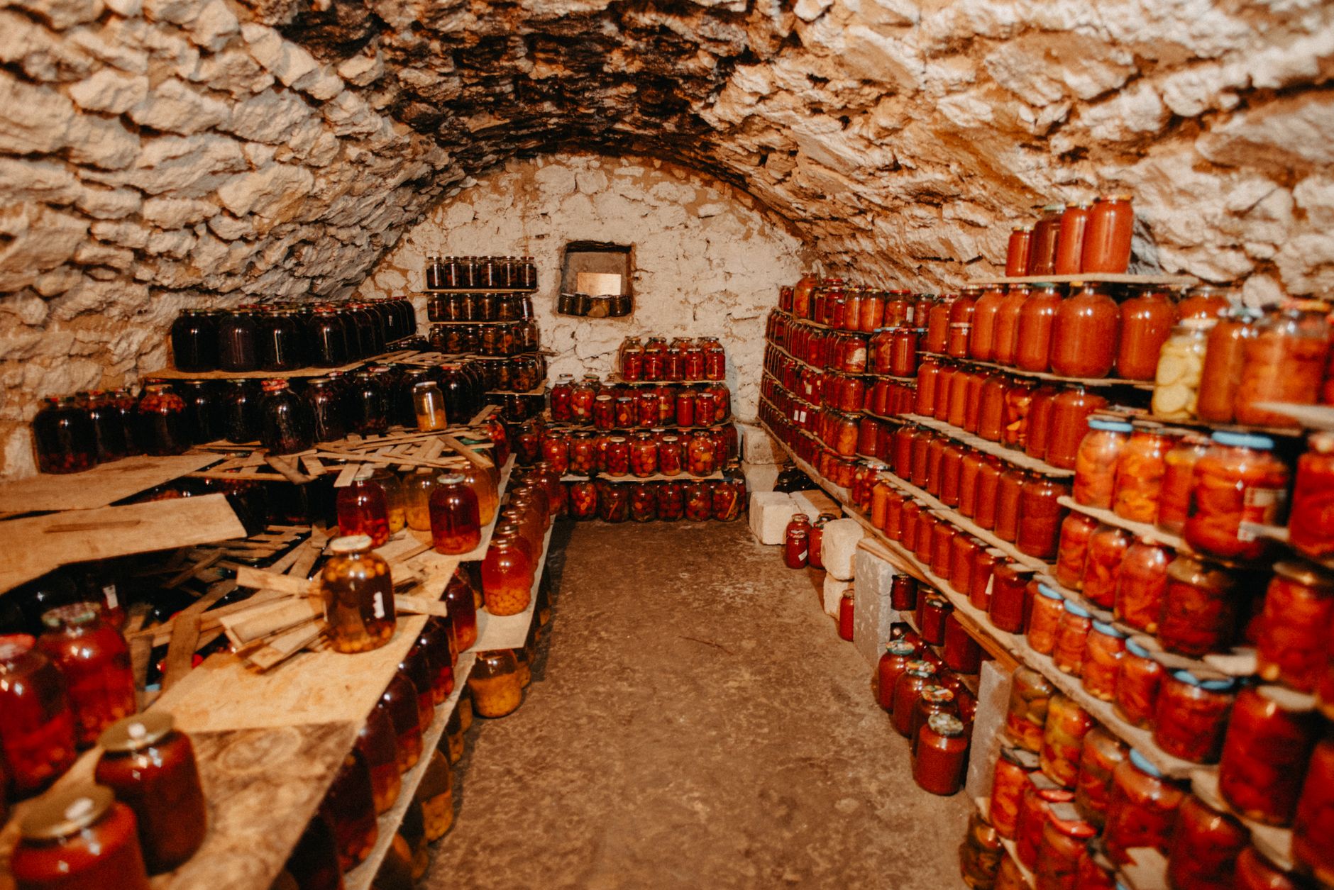 Stacks of Mylar bags and food-grade buckets in a temperature-controlled basement.