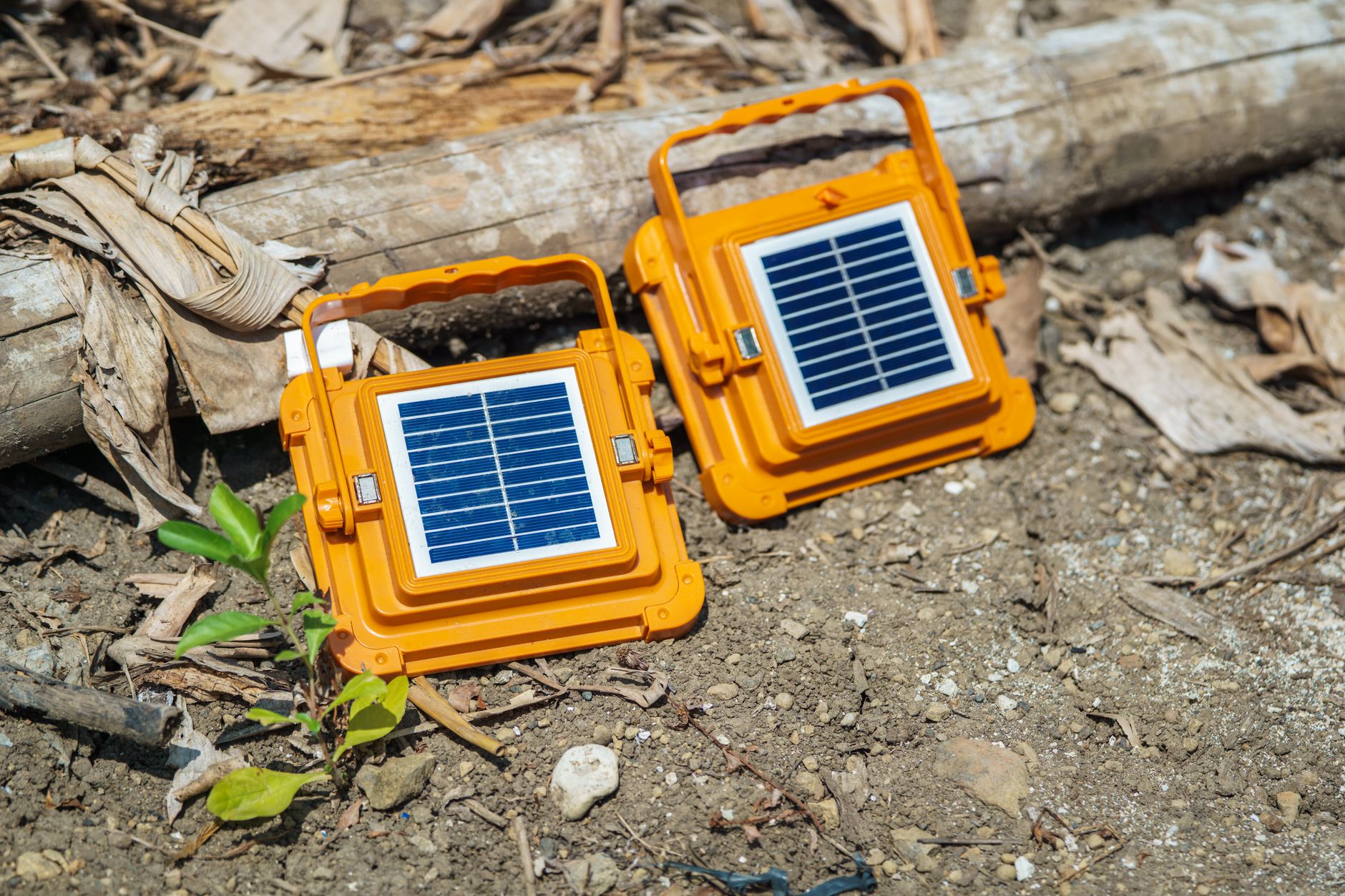 Portable solar panels charging a battery generator in an off-grid setting